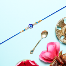 Stylish Blue Thread Rakhi With Central Stone Pearl Beads And Golden Detailing  Elegant Bracelet For Raksha Bandhan