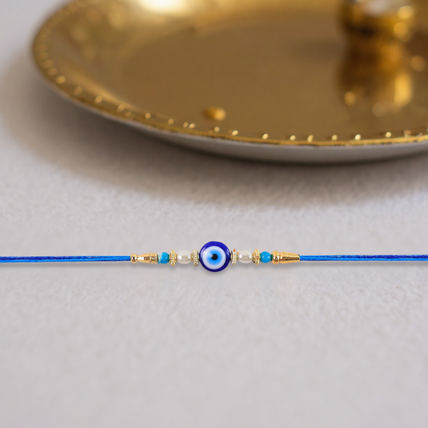 Stylish Blue Thread Rakhi With Central Stone Pearl Beads And Golden Detailing  Elegant Bracelet For Raksha Bandhan