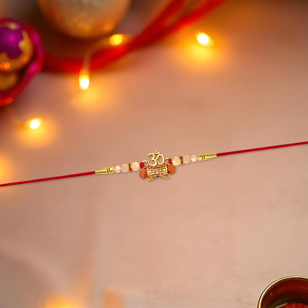 Elegant Golden Charm Rakhi With Pearl Beads And Red Thread  Traditional Raksha Bandhan Bracelet For Brother